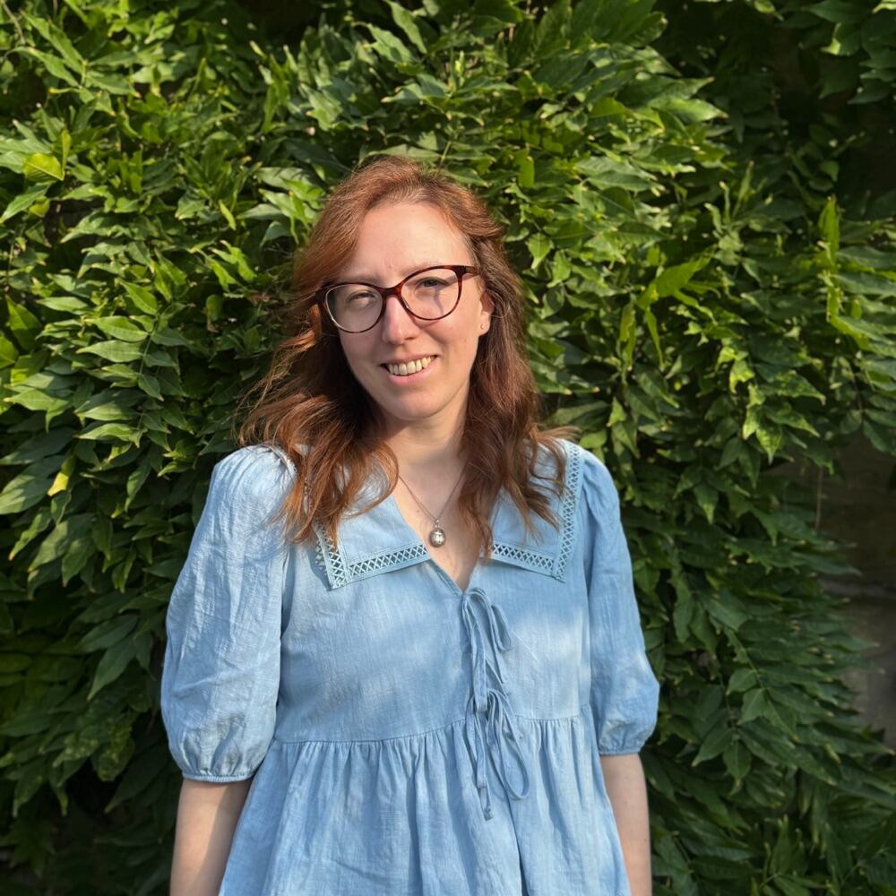 Claire, co-founder of Mini Makers, smiling in a garden
